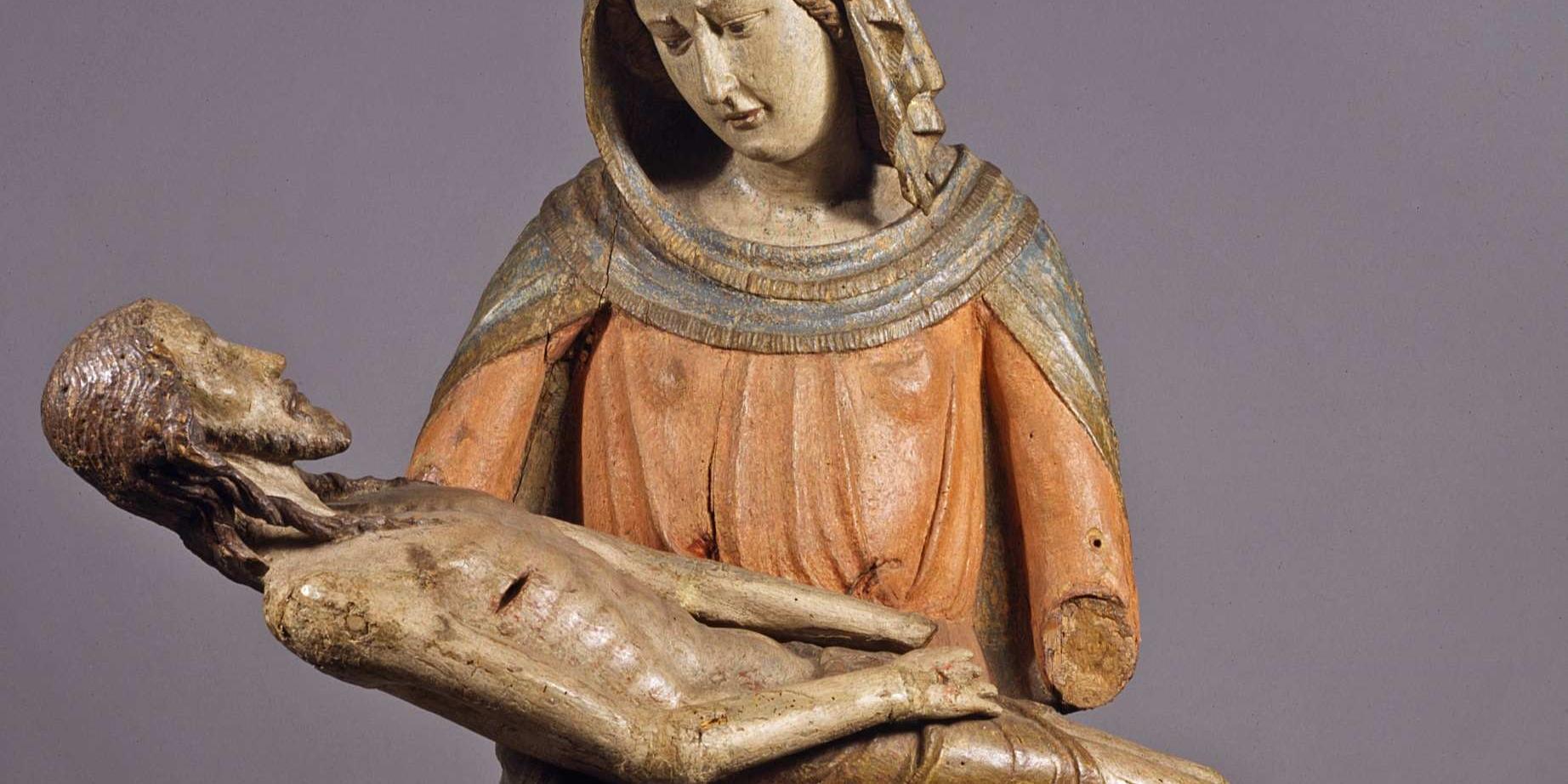 Pietà-Darstellung: Maria hält ihren toten Sohn Jesus auf dem Schoß. Holzschnitzerei.
