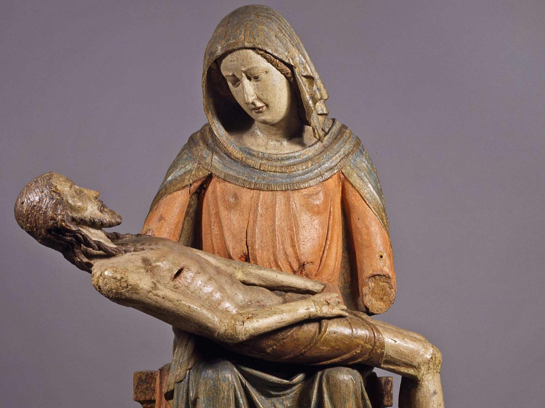 Pietà-Darstellung: Maria hält ihren toten Sohn Jesus auf dem Schoß. Holzschnitzerei.